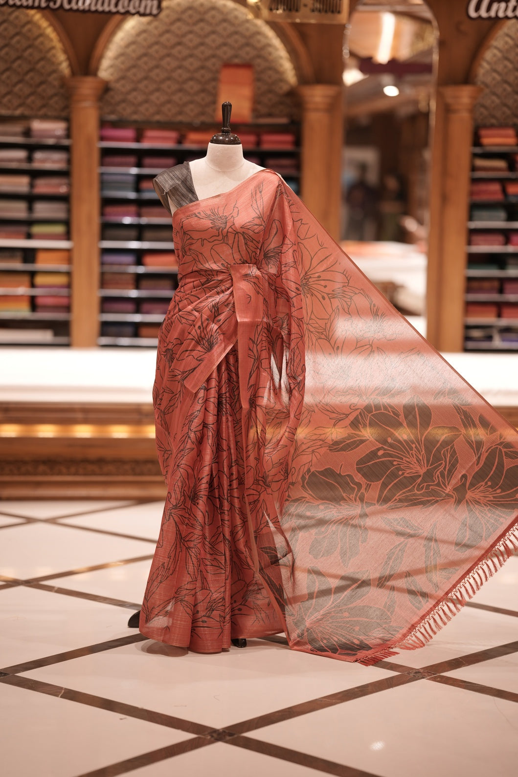 Red & Black colour Semi linen tissue saree featuring full digital floral prints across the body, The saree is highlighted with a contrast floral printed pallu and comes with a plain contrasting blouse piece.