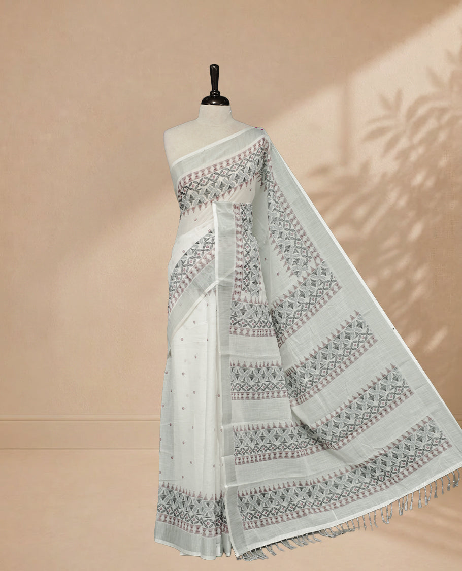 White Colour Semi Linen colour saree featuring Thread buttas on body & border, paired with matching blouse piece thread worked border.