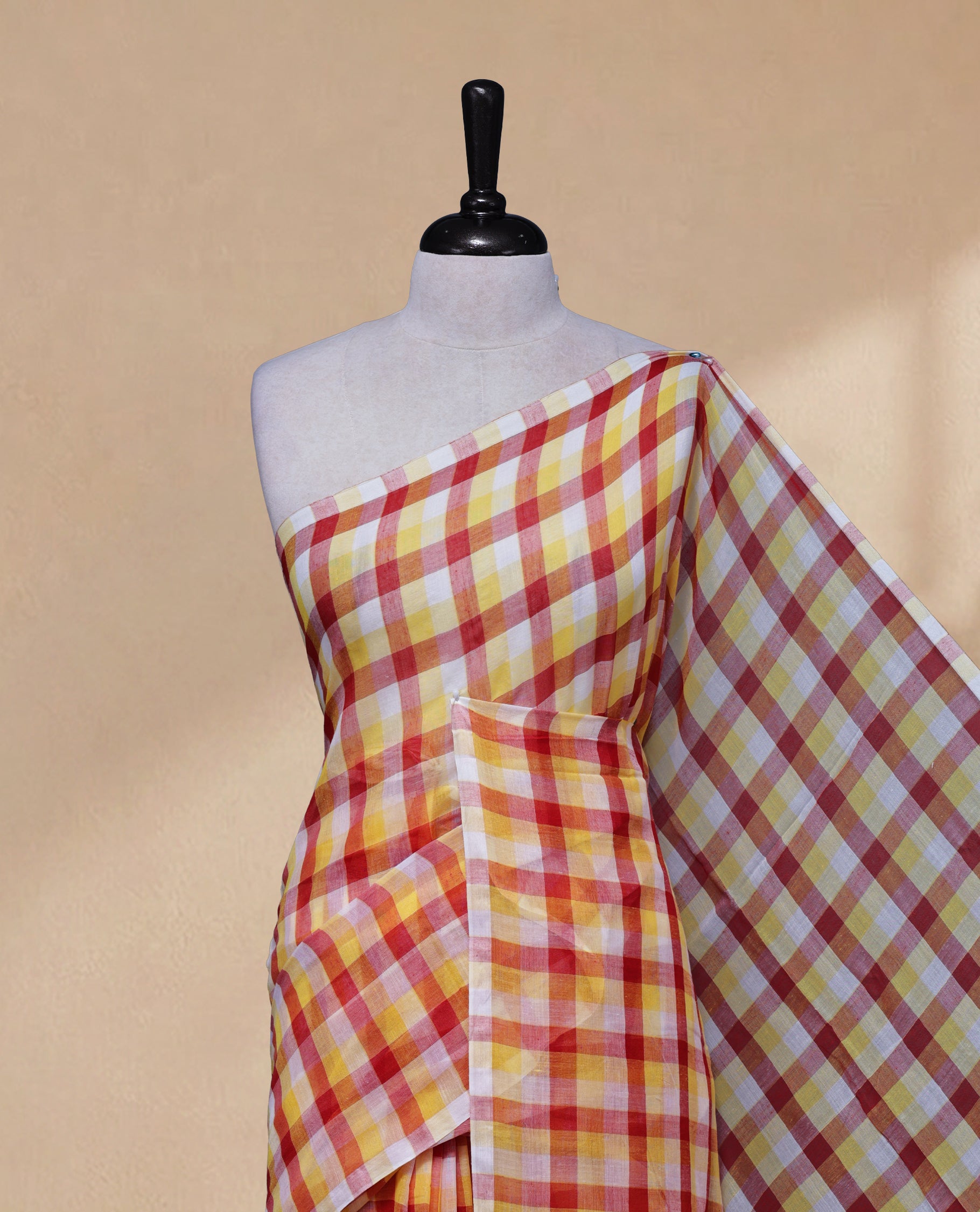 Yellow & Red colour Khadi Mul cotton saree featuring Check Pattern on body,Enhanced Minimalist Borderless Finish & elegant Tassels at pallu.