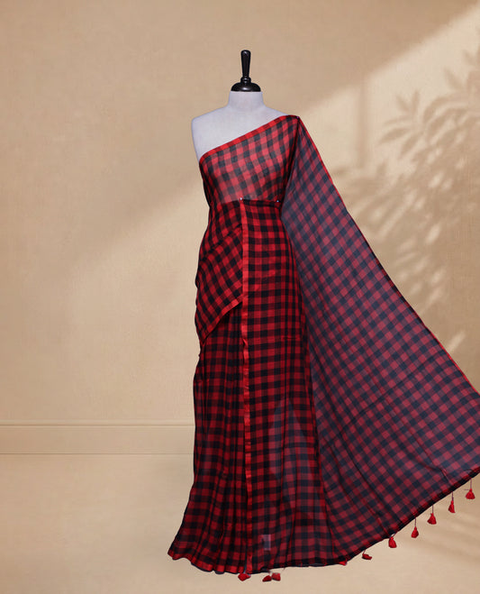 Red & Black colour Khadi Mul cotton saree featuring Check Pattern on body,Enhanced Minimalist Borderless Finish & elegant Tassels at pallu.