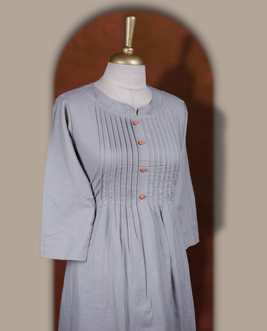 Grey colour coord set featuring a round neck kurta with pintuck detailing and wooden buttons, enhanced with vibrant floral prints along the hemline, paired with matching bottoms.