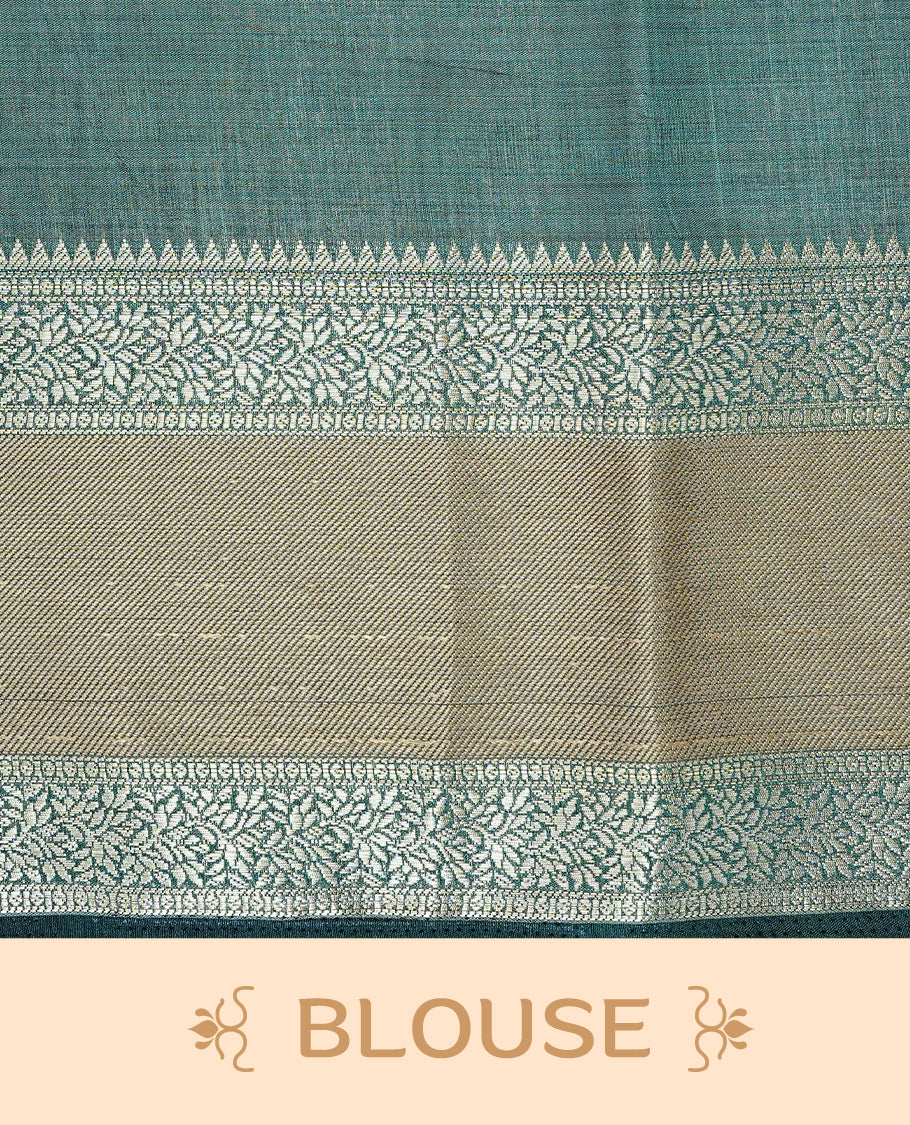 Cream colour semi Tussar silk saree featuring  Elegant body, Complemented by contrast Bottle Green with rich zari detailed for onam special, paired with contrast Blouse for Festive look.