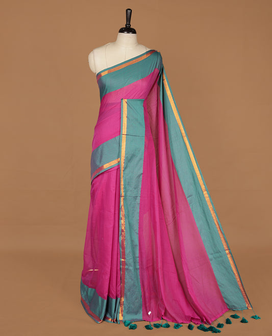 Magenta saree with Green tones, featuring a minimal plain design on the body, without blouse piece.
