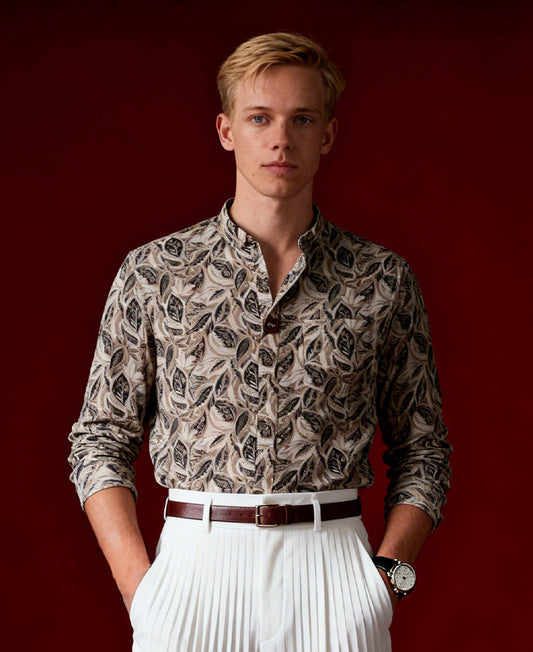 Olive green colour leaf printed full sleeve shirt featuring an all over hand drawn botanical design, Styled with a neat mandarin collar and button down front, offering a trendy and refreshing look.