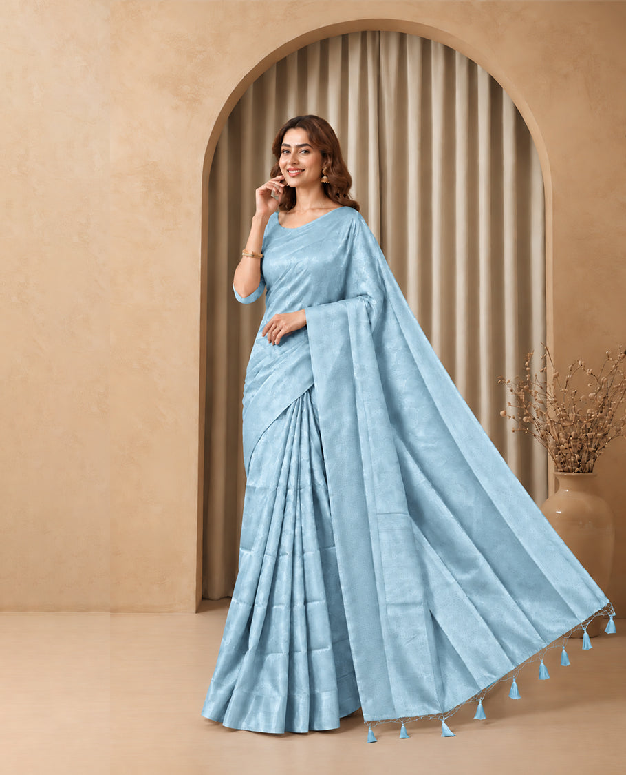 Sky Blue Colour Elite Soft Silk Saree with silver zari leaf motifs on the body, a self Banarasi silver zari border and brocade pallu, Paired with a blouse Piece featuring small silver zari buttas.