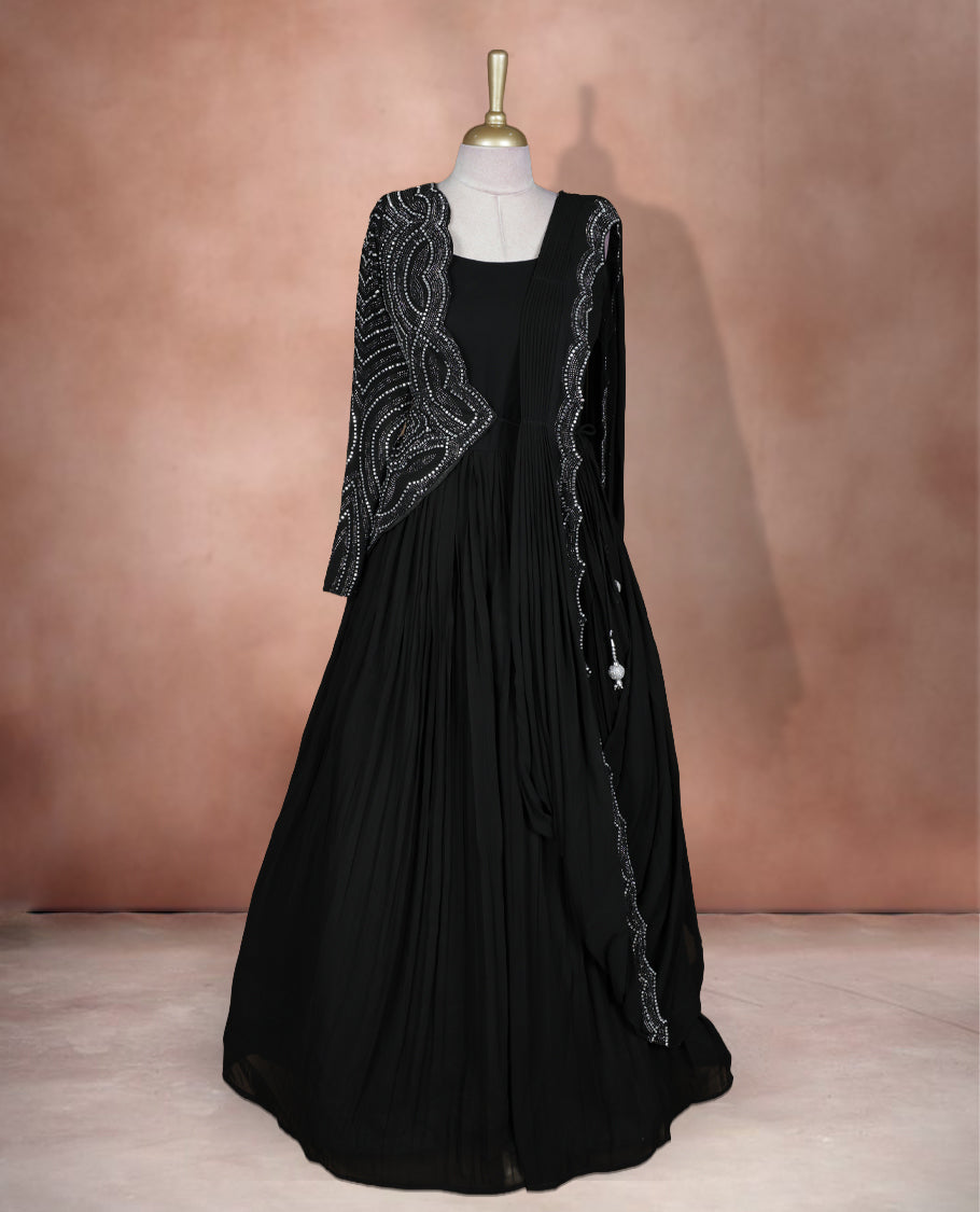 Black colour stitched gown set with sleeveless square‑neck bodice, attached pleated flare, and one‑side draped dupatta highlighted with heavy silver sequin and mirror work borders.