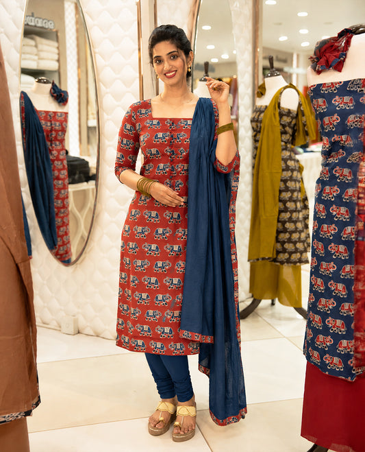 Red Colour Cotton salwar material Featuring Contrast colour Elephant motifs on body with neat piping border, paired with matching chanderi material dupatta.
