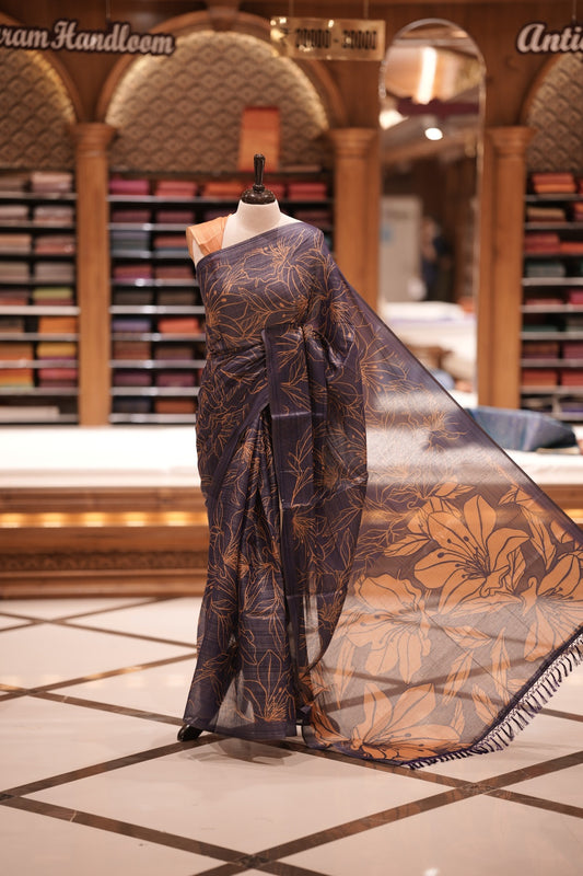 Violet & Yellow colour Semi linen tissue saree featuring full digital floral prints across the body, The saree is highlighted with a contrast floral printed pallu and comes with a plain contrasting blouse piece.