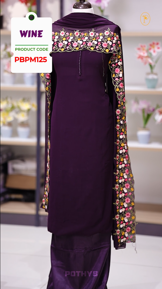 Wine colour Chiffon churidhar material featuring a plain top adorned with delicate beads work on the neckline, paired with a plain bottom, Highlighted by a dupatta with floral embroidery, sequins, and scalloped edges.