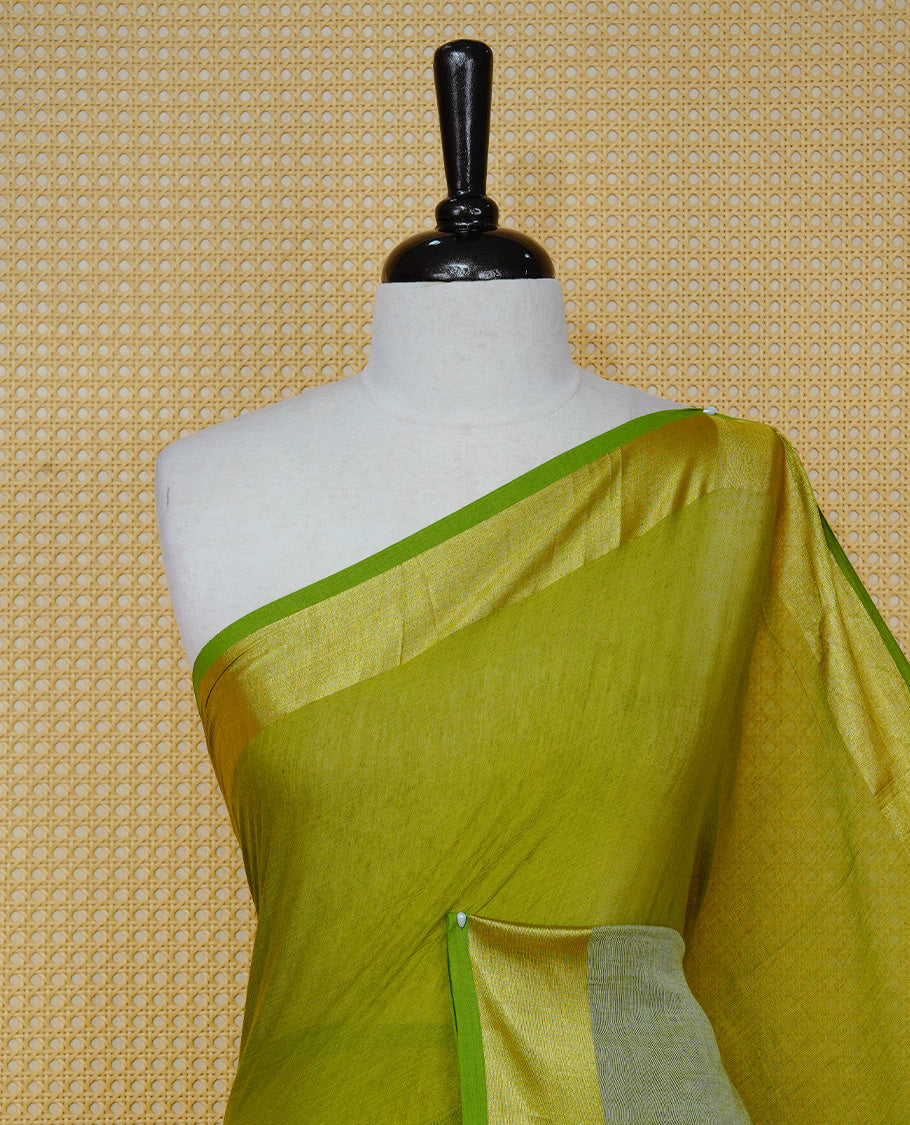 Parrot Green with Sage Green Dual colour Mul cotton saree featuring Half & Half Dual Tone Plain Body, Complemented by Gold tissue Border & pallu.
