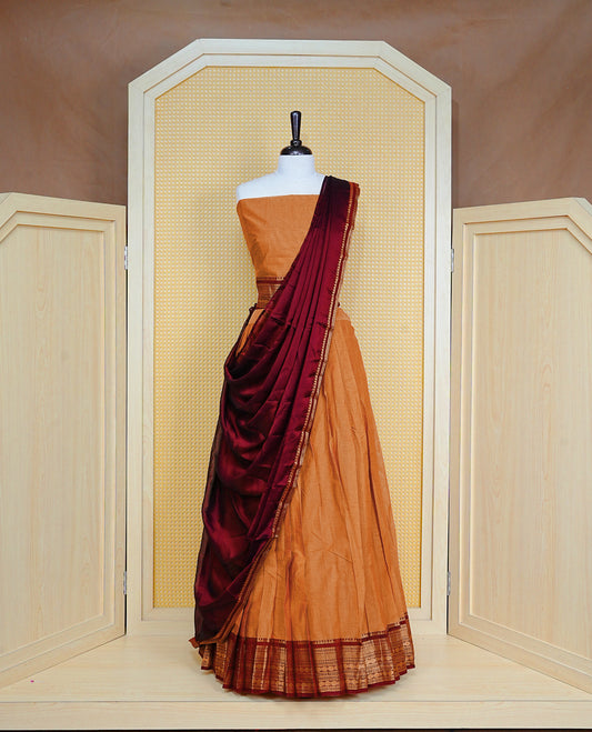 Mustard colour Semi Stitched Dhavni set Featuring Mustard Skirt With Contrast Dark chocolate colour with Zari border, paired with UnStitched Blouse & Elegant Dupatta.